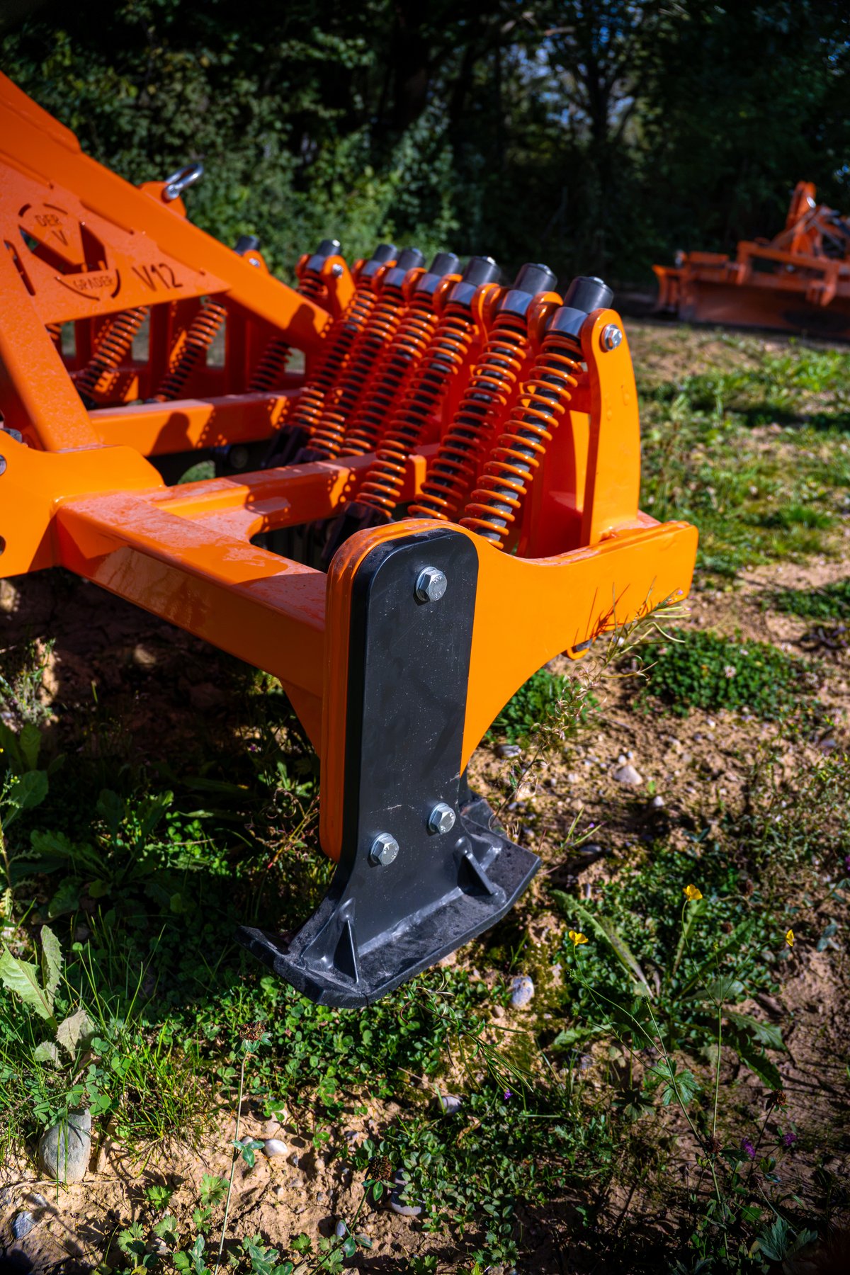 V12 ripper tine and spring close-up